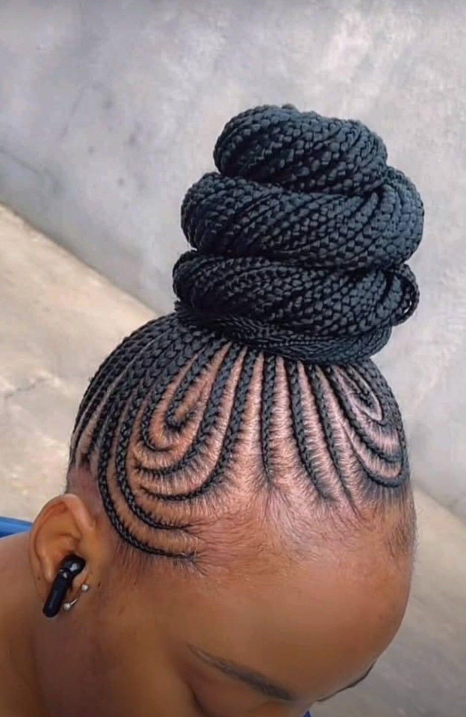 Cornrow updo with a braided bun