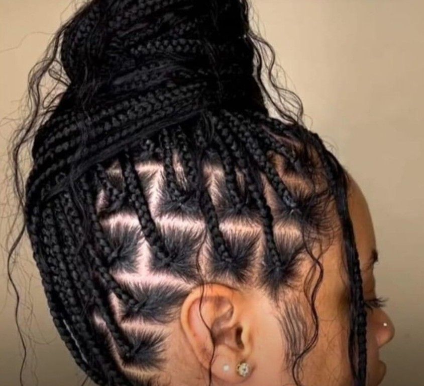 Triangle-part knotless braids in a high bun